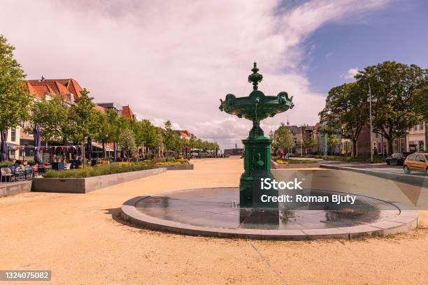 Fountain On The Square In The City Of Vlissingen In Holland The Background Is A Blue Sky With White Clouds And The Morning Sun Shines Stock Photo - Download Image Now