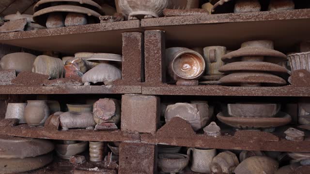 Pottery on Shelves in Kiln with Ash Everywhere