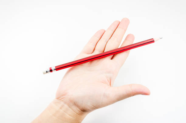 istock Red pencil  on hand woman on white 1324082001