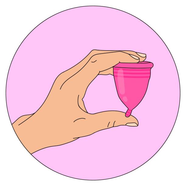 istock Illustration of a hand holding a menstrual Cup. Eco friendly option for replacing pads and tampons. An environmentally friendly alternative. Feminine hygiene. Colorized line drawing in a circle 1324085787