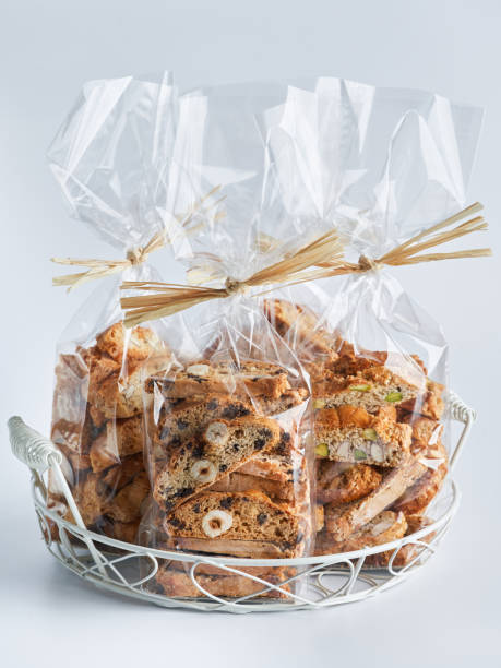 istock Assorted Biscotti Cantucci Biscuits Cookies in plastic wrap packaging for sale. Italian dessert cookies close up, selective focus, copy space. Homemade bakery confectionery concept for sale. 1324088687