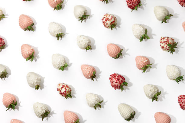 Chocolate dipped strawberries pattern on white background Chocolate dipped strawberries pattern, white background chocolate covered strawberries stock pictures, royalty-free photos & images