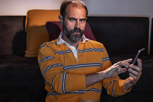 istock Watching a sport match and checking a betting results 1324090518