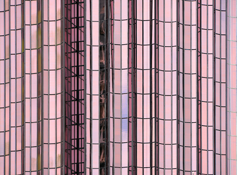 Abidjan, Ivory Coast / Côte d'Ivoire: Postel 2001 tower, a government owned pink skyscraper inaugurated in 1984, it is still the tallest building in the city today. Deemed dangerous due to its dilapidation, the tower was emptied of its occupants in 2013 and subject to a vast rehabilitation program. Designed by the Ivorian-Lebanese architect Pierre Fakhoury. Located on Rue Jesse Owens, Plateau district.