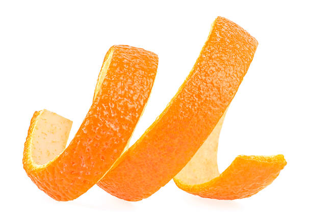 istock Curly orange zest isolated on a white background. Spiral orange peel. 1324091985