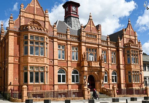 Merthyr Tydfil, Wales - May 2021: Exterior view of the front of the Redhouse, an arts and cultural centre housed in the old Town Hall. It is a Grade II listed building.