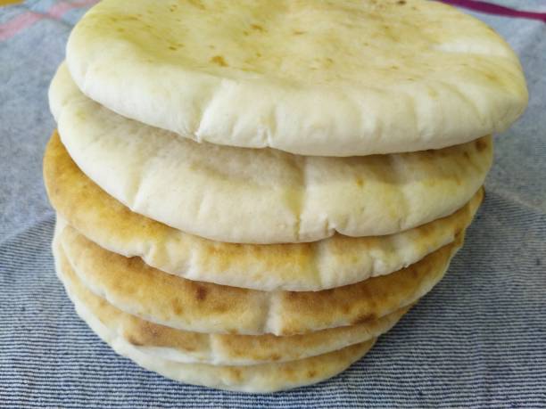 istock Whole wheat pita bread, Middle Eastern cuisine 1324092813