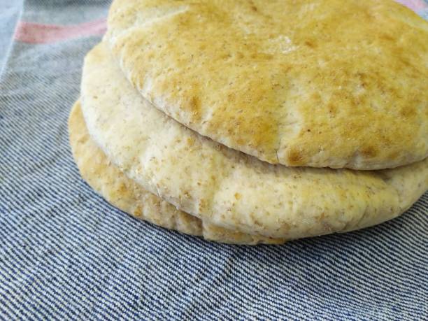 istock Whole wheat pita bread, Middle Eastern cuisine 1324092951