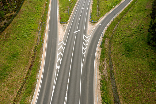 top down view of a multi-lane highway with driveways, close-up