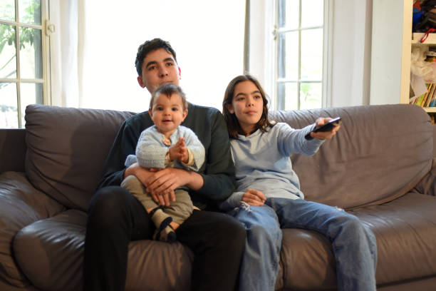 istock watching tv as a family 1324094027