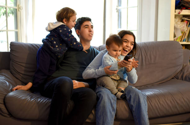 istock watching tv as a family 1324094322