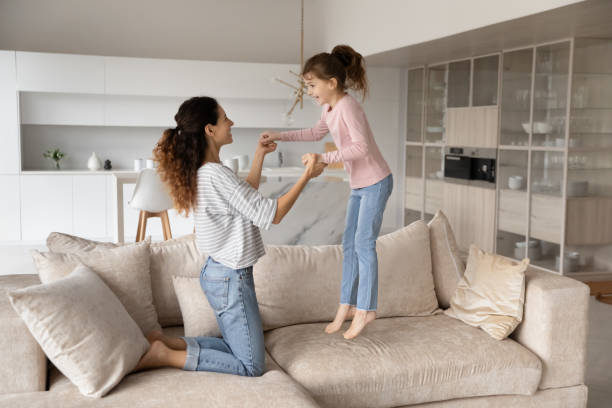 istock Overjoyed Hispanic mom and daughter have fun at home 1324096488