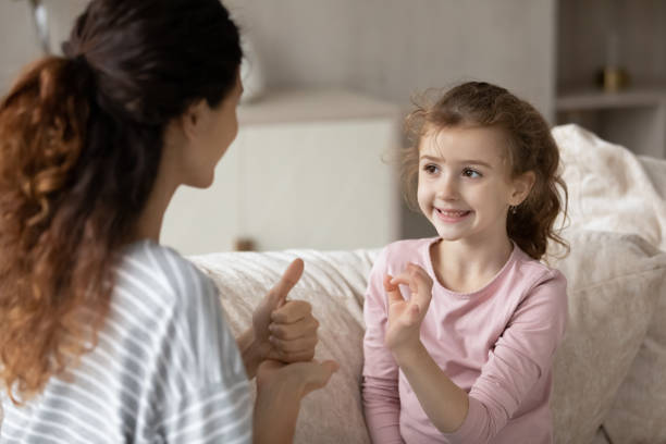 istock Little ethnic girl child talk using sign language 1324096516