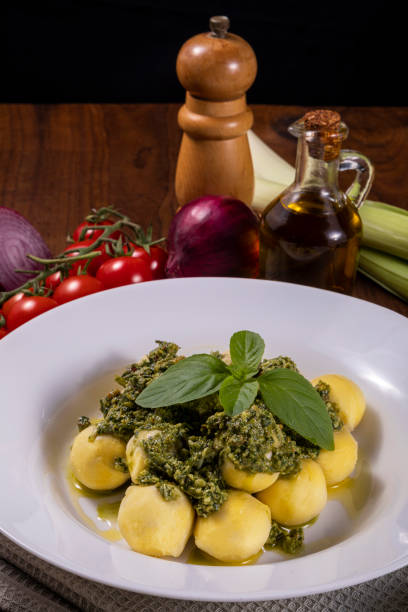 istock Potato gnocchi with pesto sauce 1324104724