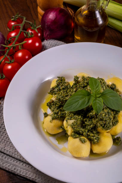 istock Potato gnocchi with pesto sauce 1324104746