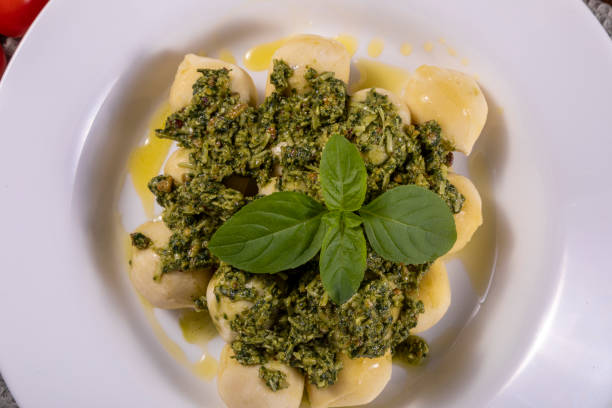 istock Potato gnocchi with pesto sauce 1324104768