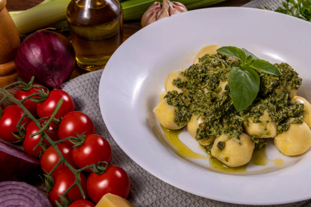 istock Potato gnocchi with pesto sauce 1324104873