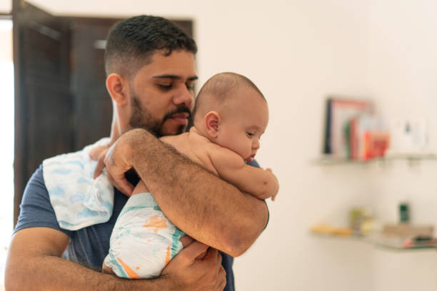 istock Father holding baby son sleep 1324105877