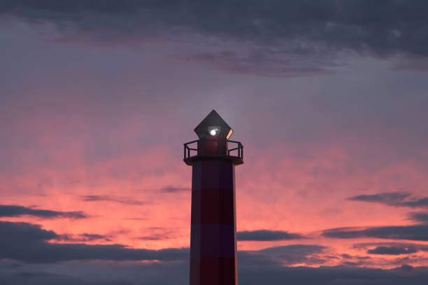 istock Marine navigational beacon in action. Beautiful sunset sky in the background 1324109266