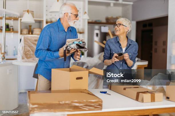 Senior Couple Moving Stock Photo - Download Image Now - Relocation, Senior Adult, Moving House