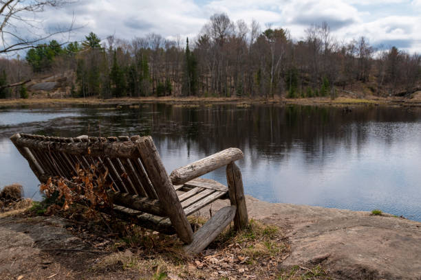 istock Old Bench Overlooking a Lake in Ontario 1324116127