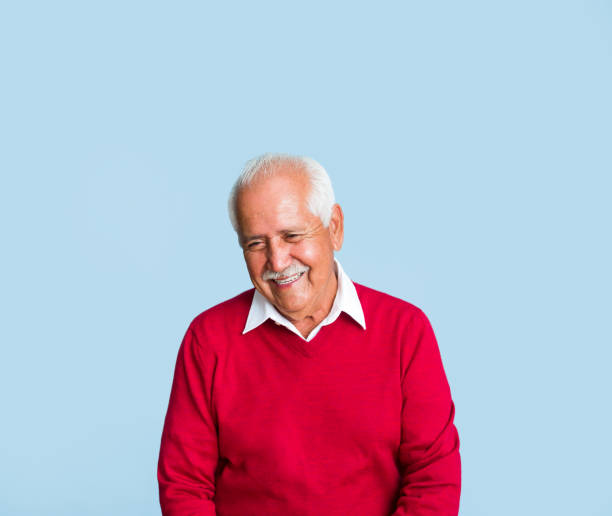 istock Happy senior man looking down and smiling 1324116328