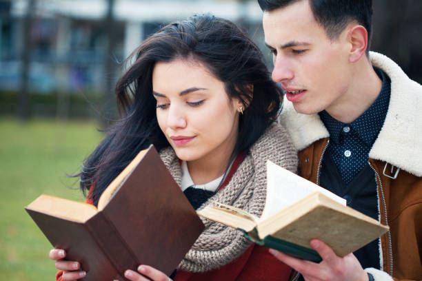 istock Young couple reading books 1324116339