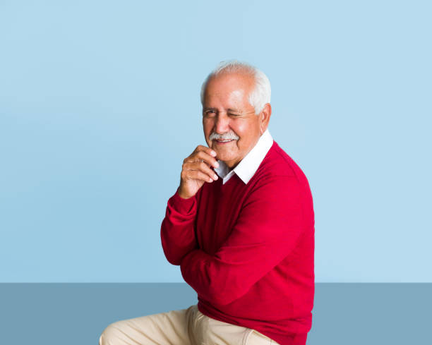 istock Playful senior man winking at camera 1324116360