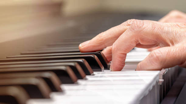 istock Adult Hand Practicing Playing Piano 1324117870
