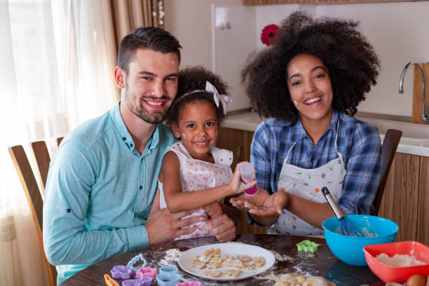 istock Young happy family baking together 1324118037