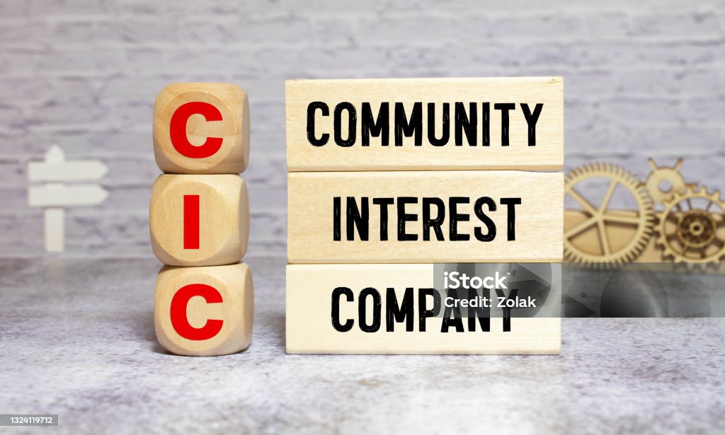 Community Interest Company - CIC on wooden block ' Become A Sponsor ' word made of square letter word on grey background. Applying Stock Photo