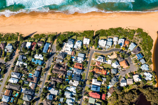 istock Coastal Suburb overhead perspective roof tops 1324121174