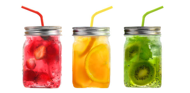 istock Bright Colorful refreshing summer drinks in glass jars with lid and straws isolated on a white background 1324121192