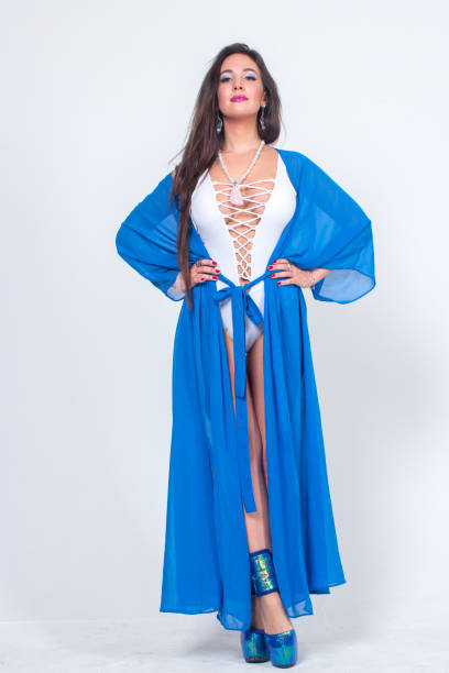 istock Pretty woman posing in bathrobe 1324126678