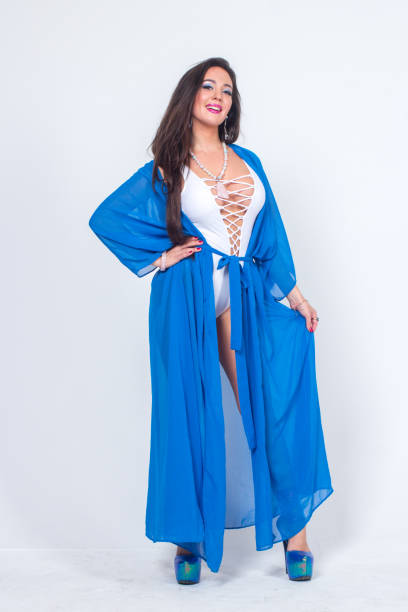 istock Pretty woman posing in bathrobe 1324126694