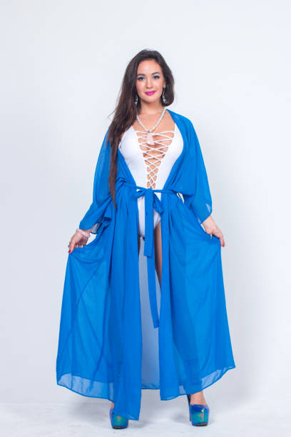 istock Pretty woman posing in bathrobe 1324127213