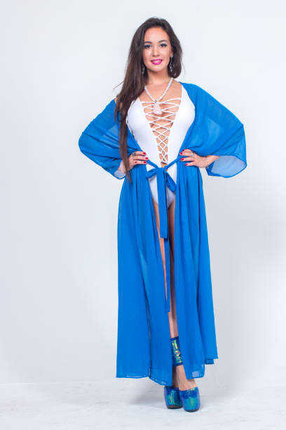 istock Pretty woman posing in bathrobe 1324127249
