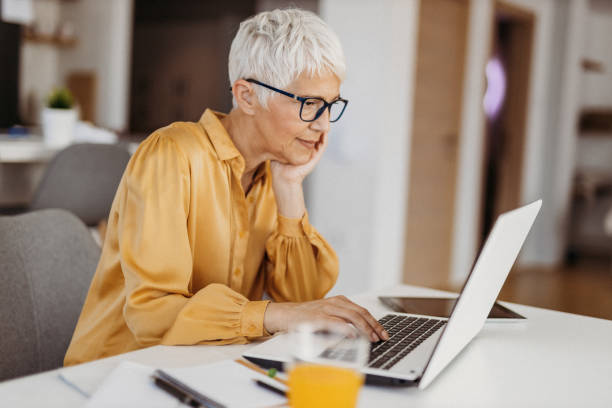 istock Senior woman working 1324129335