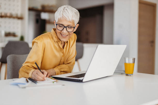 istock Senior woman working 1324129691