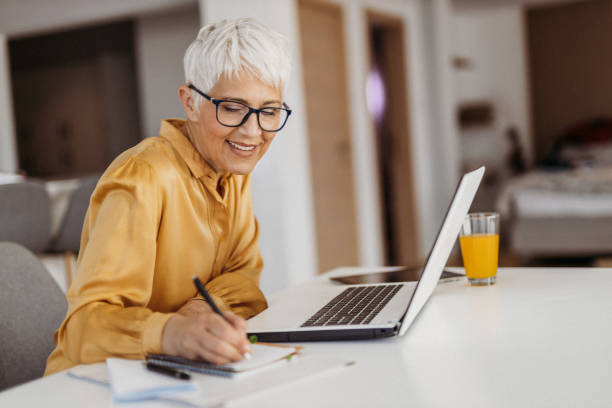 istock Senior woman working 1324129716