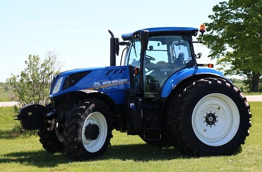 Chesley, Ontario / Canada - June 6, 2020: Brand new T7.260 New Holland blue farm tractor
