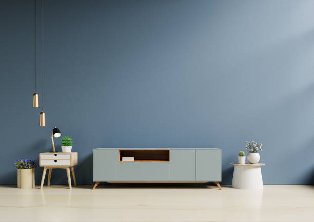 istock Cabinet TV in modern empty room with behind the dark blue wall. 1324131014