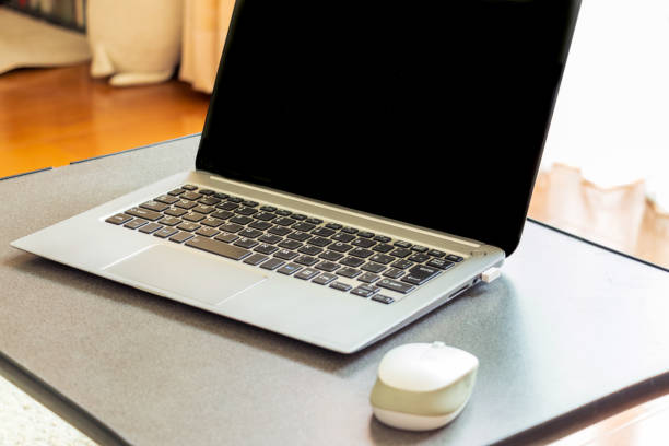 istock Laptop placed by the window in a bright room 1324134227