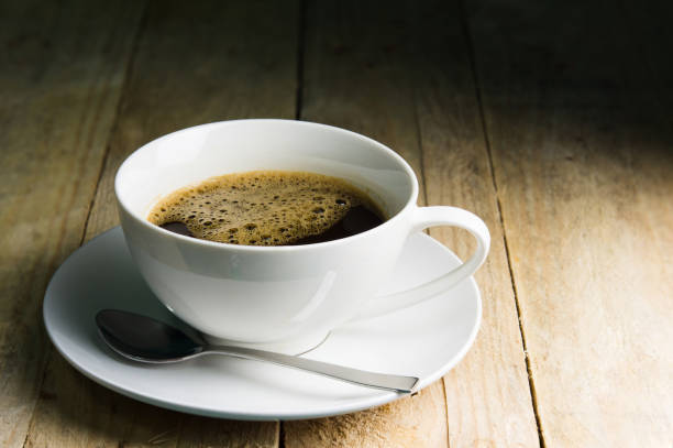 istock Coffee cup on wooden background. 1324139460