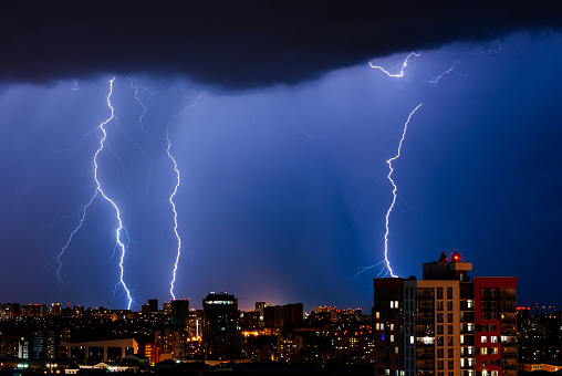 Thunderstorm with lightning over the night city