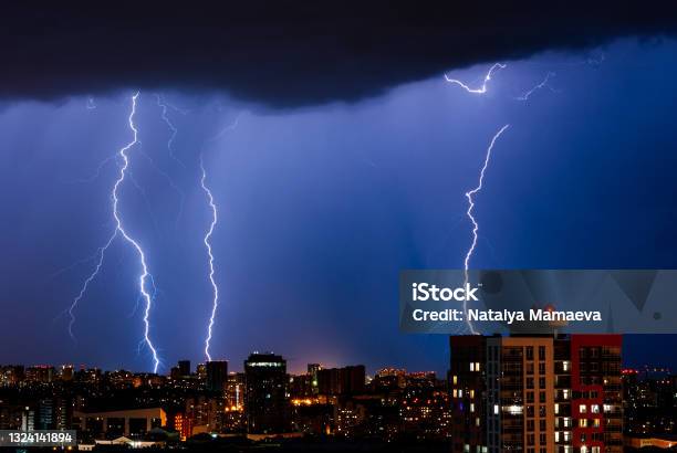 Lightning In Night City Stock Photo - Download Image Now - Lightning, Air Attack, Building Exterior