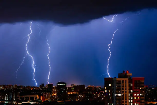 Thunderstorm with lightning over the night city