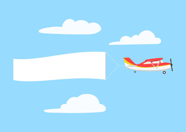 istock Retro aircraft with ribbon banner advertising, in the sky above the clouds. 1324143533