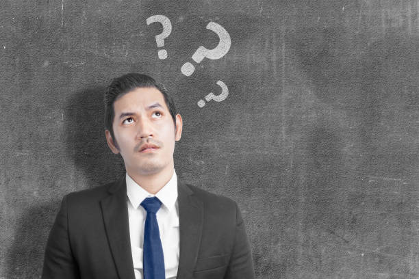 istock Asian businessman thinking something with question mark 1324143657