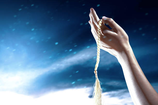 istock Muslim man praying with prayer beads on his hands 1324144605